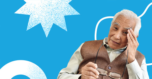 A photo of an elderly man holding a pair of glasses