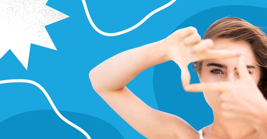 A photo of woman looking through her fingers