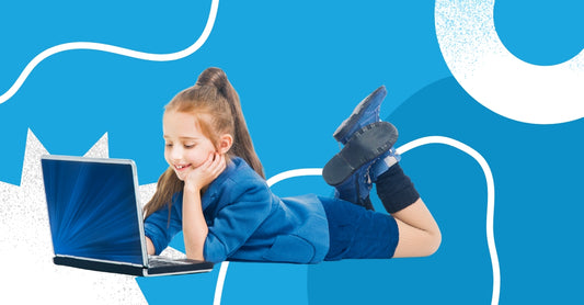 A photo of a girl playing on her laptop, engaged in screen time